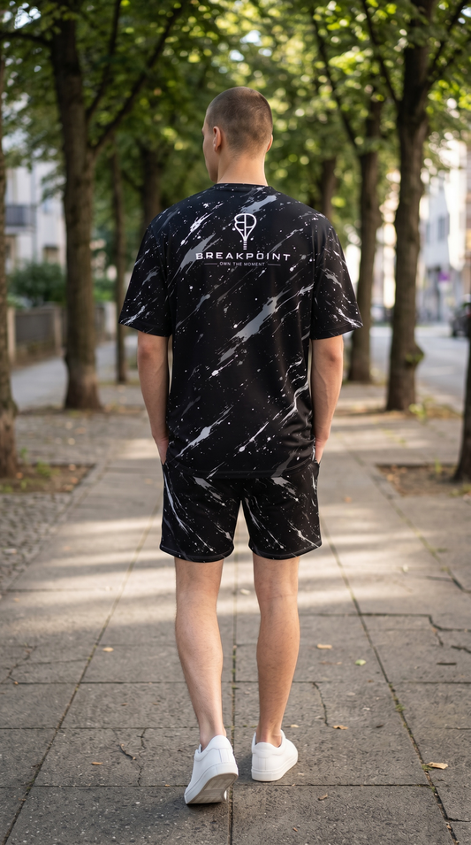 BREAKPOINT Splatter Strike Black Performance Tee and tennis shorts — black tennis and golf outfit with white splatter pattern, alternate view