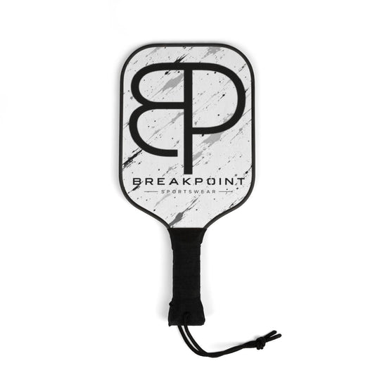 BREAKPOINT Sportswear professional pickleball paddle with a white and black marble design and ergonomic black grip.