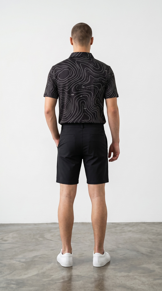 BREAKPOINT Breakline Black Performance Polo — alternate view of black golf and tennis polo with Breakline contour pattern