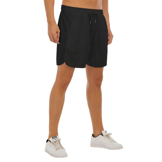 BREAKPOINT Sportswear black athletic shorts with side-split hems on a male model, featuring lightweight polyester.