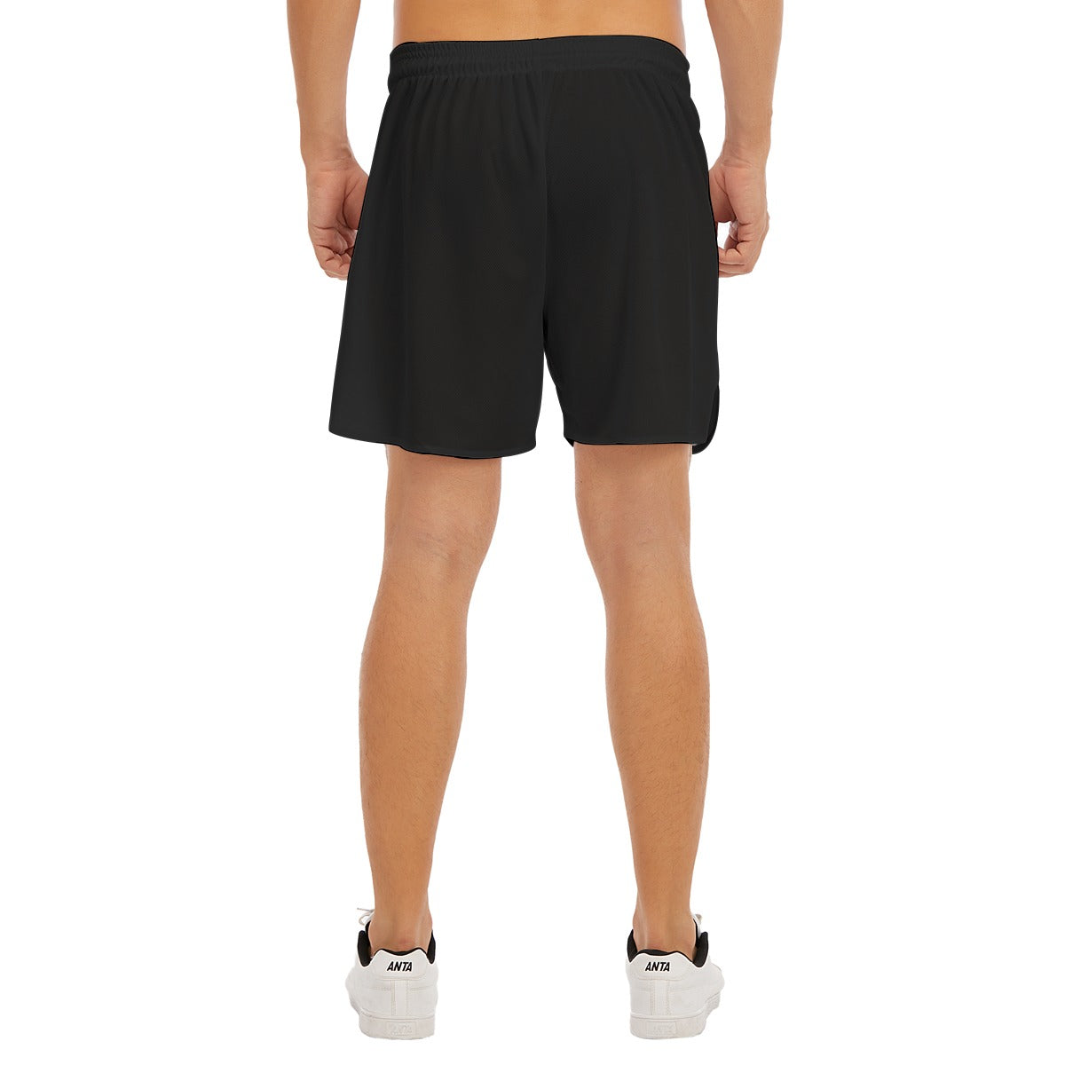 Back view of BREAKPOINT Sportswear black athletic shorts with side-split hem on a model, white background.
