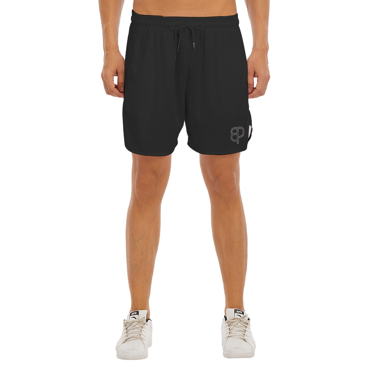 BREAKPOINT Sportswear black athletic shorts with side-split hem and white logo on leg worn by a male model