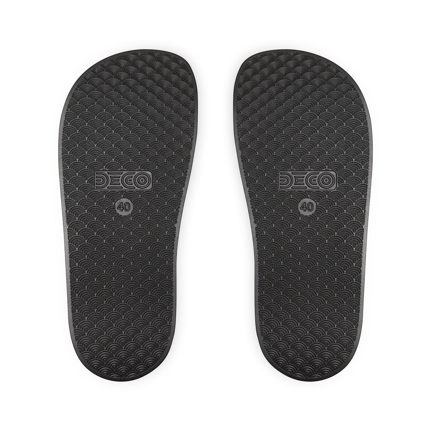 BREAKPOINT Sportswear black golf slides showing the textured, water-friendly PU-foam sole with a wave pattern.