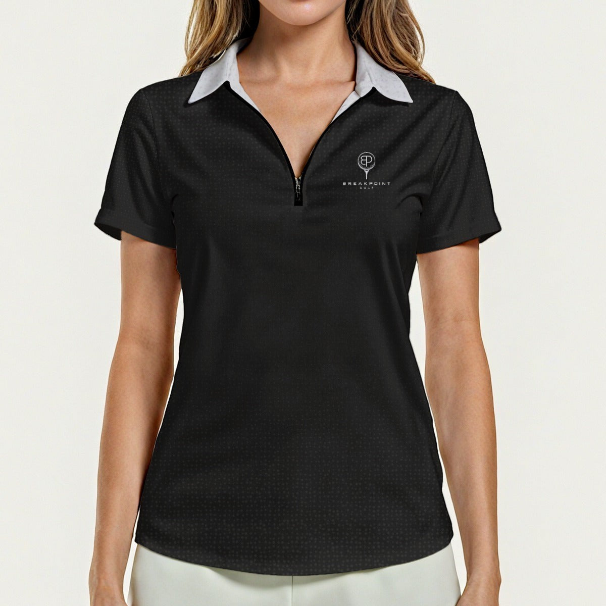 BREAKPOINT Sportswear women's black lightweight zip polo with a white collar and small logo on the chest