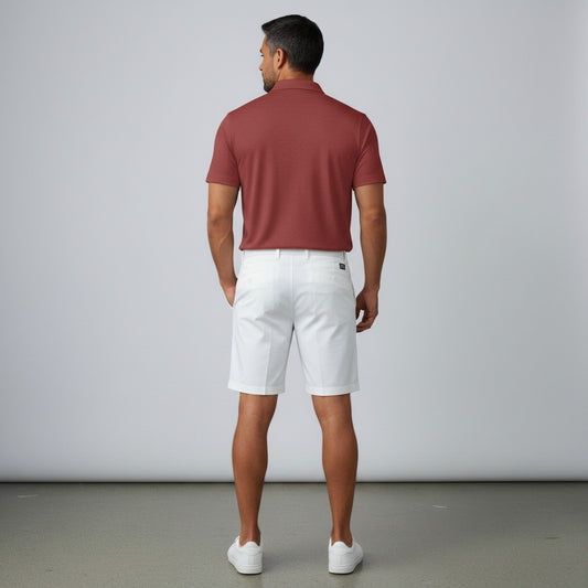 BREAKPOINT Sportswear crimson performance zip polo shirt worn by a man with white shorts, back view.