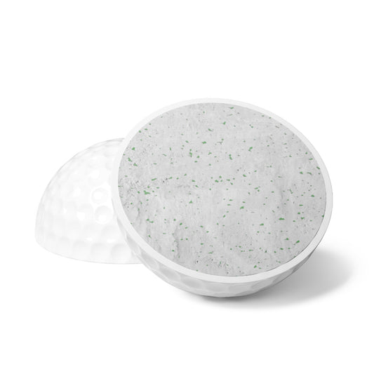 BREAKPOINT Sportswear golf ball cross-section showing durable rubber core and white Surlyn cover construction.