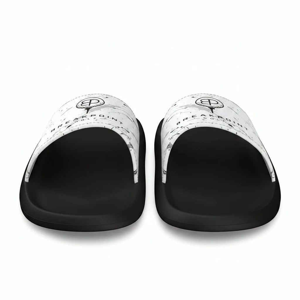 BREAKPOINT Sportswear slides featuring white straps with a black logo and black soles.