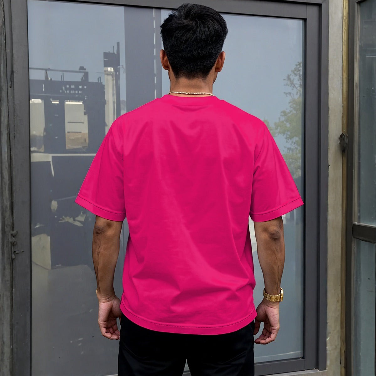 BREAKPOINT Sportswear hot pink drop shoulder tee on a male model wearing black joggers and white sneakers