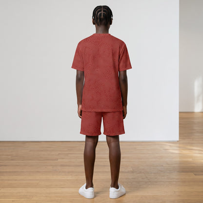 BREAKPOINT Sportswear kids' red all-over print V-neck tee and shorts match set worn by a child from the back.