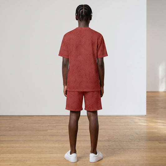 BREAKPOINT Sportswear kids' red all-over print V-neck tee and shorts match set worn by a child from the back.