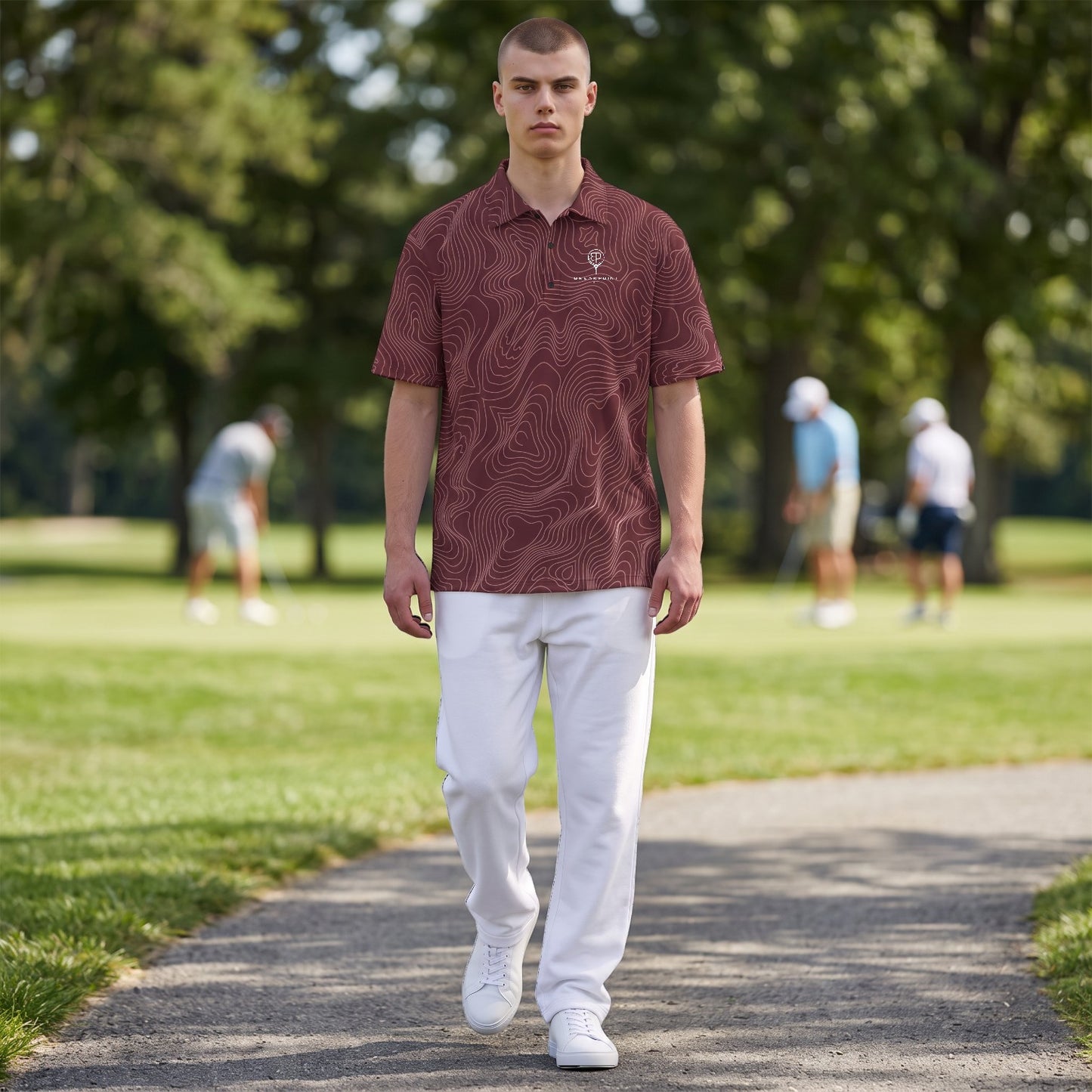 BREAKPOINT Sportswear maroon performance polo with white topographic pattern, worn by a man on a golf course.