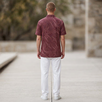 BREAKPOINT Sportswear maroon performance polo with white topographic pattern, worn by a man from the back view.