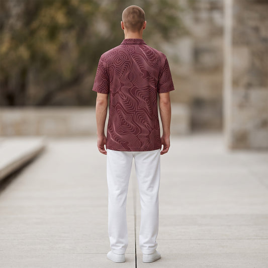BREAKPOINT Sportswear maroon performance polo with white topographic pattern, worn by a man from the back view.