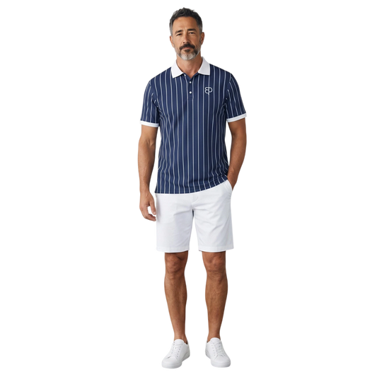 Model wearing a BREAKPOINT Sportswear navy blue pinstripe polo shirt with white collar and trim, paired with shorts.