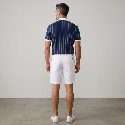 BREAKPOINT Sportswear men's navy blue polo shirt with white vertical stripes and white collar, back view