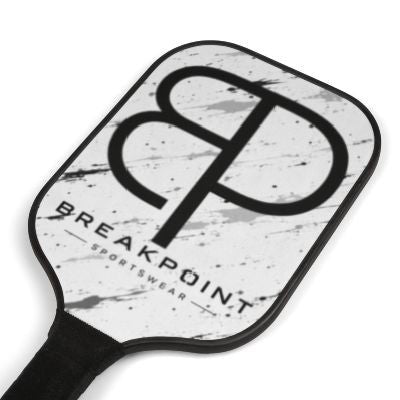 BREAKPOINT Sportswear professional pickleball paddle with a white and black marble-inspired design and logo.