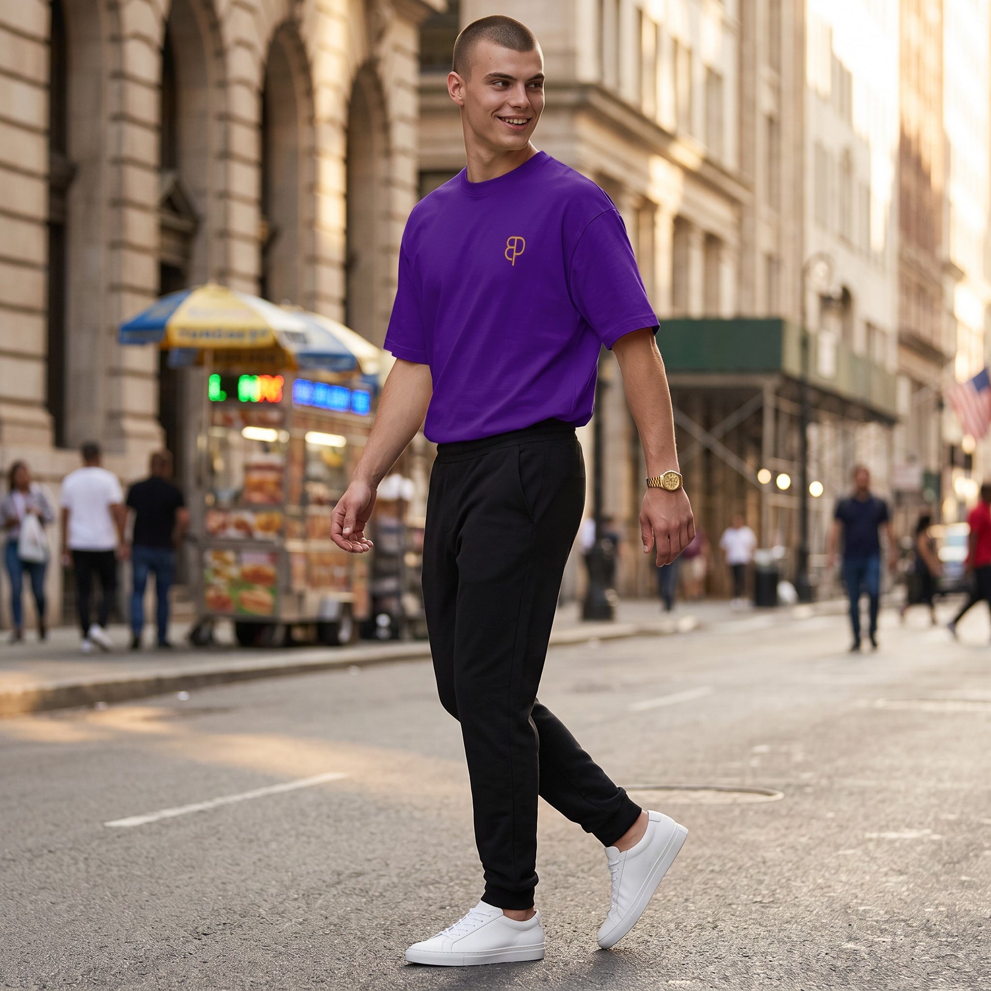 BREAKPOINT Sportswear purple drop-shoulder t-shirt worn by a man walking on a city street.