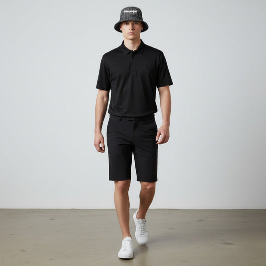 BREAKPOINT Sportswear reversible bucket hat with golf print worn by a male model in a black polo and shorts