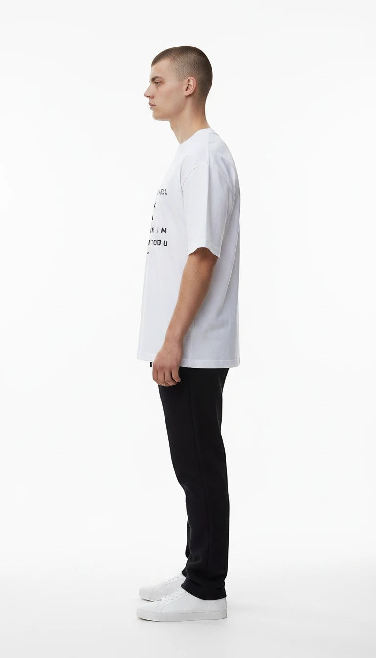 BREAKPOINT Sportswear white cotton Identity Tee with relaxed streetwear fit and black text, worn by a male model.