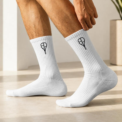 BREAKPOINT Sportswear white cotton crew socks with black embroidered tennis racket logo on a person's feet