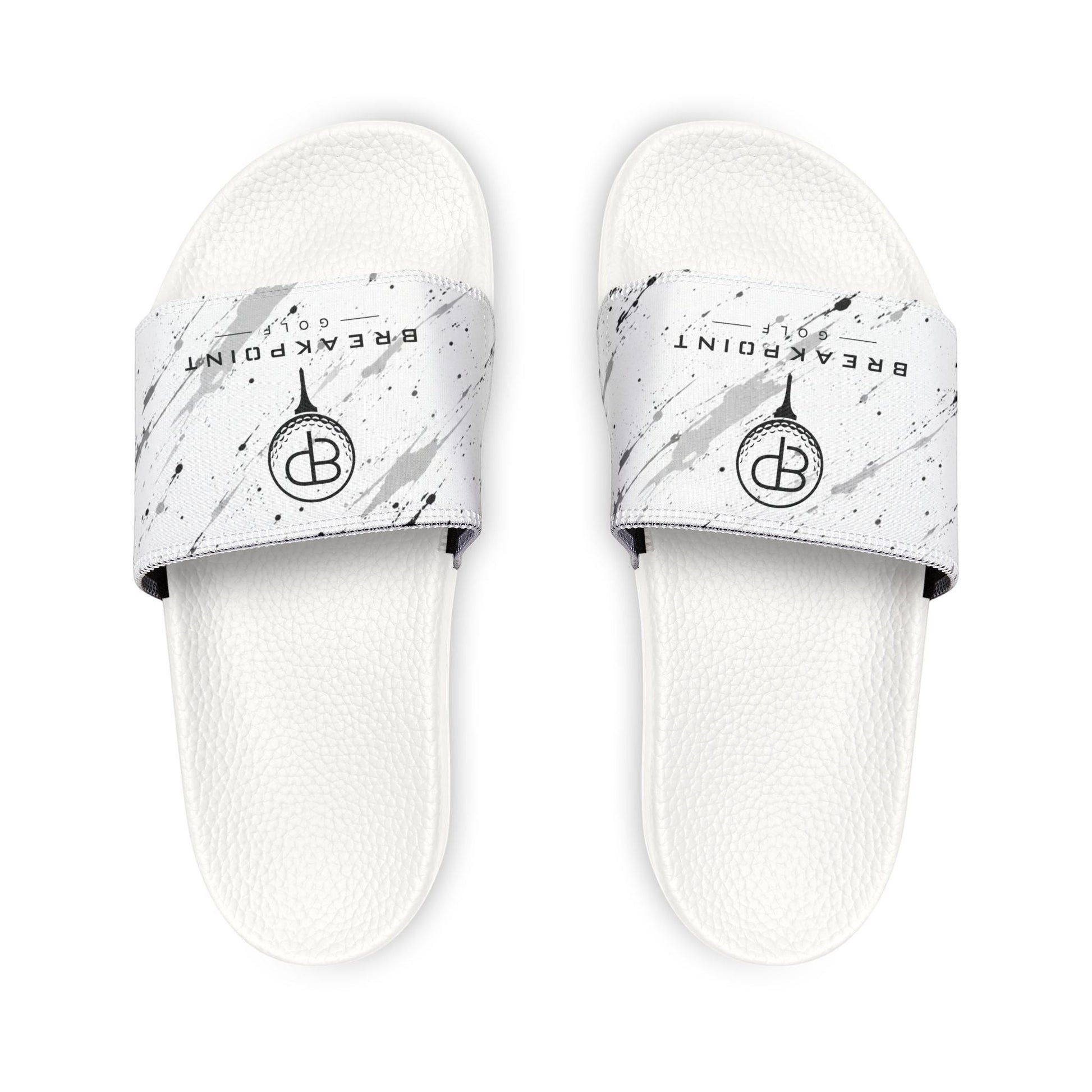 BREAKPOINT Sportswear white golf slides with removable straps featuring a black paint splatter design and logo