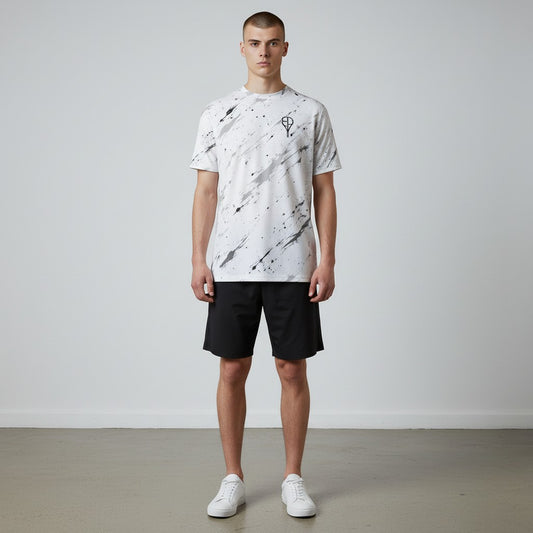 BREAKPOINT Sportswear white tennis t-shirt with black splatter print, moisture-wicking performance knit, and crew neck.